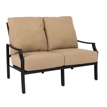 The Nico Cushion Love Seat is a two-seater outdoor sofa featuring a minimalist design, black metal frame, straight armrests, and beige cushions, perfect for patio or garden use.