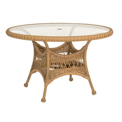 The Sommerwind 48 Round Umbrella Table features a glass top, intricate wicker patterns, a central hole for umbrella use, and support from woven crossbars. Its neutral brown color is perfect for both indoor and outdoor settings.