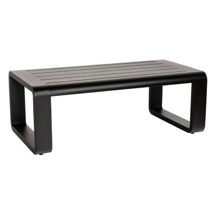 The Vale Coffee Table is a sleek, modern piece with a black finish and rectangular shape. It features a slatted top and two rounded rectangular legs connected at the sides, offering a minimalist and stylish design.