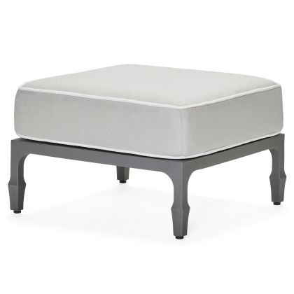 The Alberti Ottoman features a thick light gray cushion atop a dark gray metal frame with four short, angled legs for a modern look.