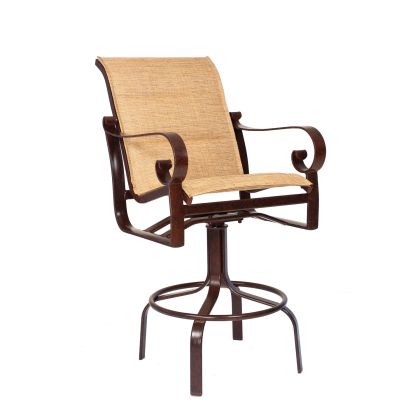 The Belden Padded Sling Swivel Bar Stool has a dark brown metal frame with armrests, a light tan woven fabric seat and backrest, and a circular base with a footrest.