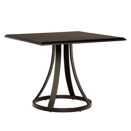 The Solid Cast Mainstreet Square Bistro Umbrella Table is dark brown, featuring a flat square top with a central hole and supported by four curved legs that converge into a circular base.