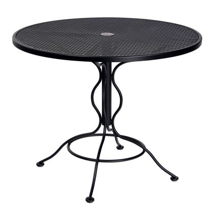 The Iron Round Bistro Umbrella Table is a black metal patio table with a mesh top and decorative curved legs, perfect for outdoor use.