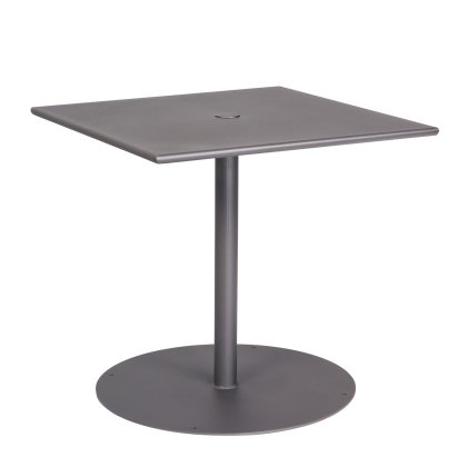 The Solid Iron Top Pedestal Base Square Bistro Table features a square metal top with a central pedestal column, a circular base, and a dark gray finish. It includes a smooth surface with an umbrella hole in the center.