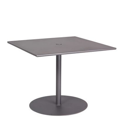 A minimalist Solid Iron Top Pedestal Base Square Dining Umbrella Table features a smooth square metal tabletop supported by a single round pedestal base, all displayed against a white background.