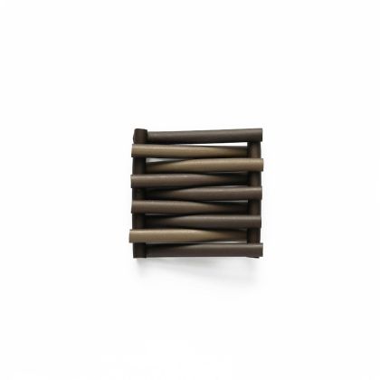 A small stack of Trax Mink dark brown cylindrical rods arranged horizontally in parallel on a plain white background, aligned closely with varying shades to form a simple geometric pattern.