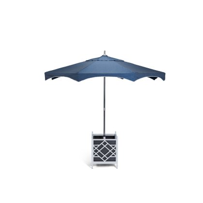 The Alexa Hampton Forum Umbrella in navy blue stands open in a modern planter umbrella stand with a geometric lattice design, isolated on a white background.